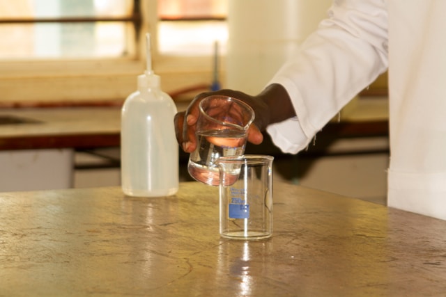 Glass bottle of distilled water stored in a cool, dark place.
