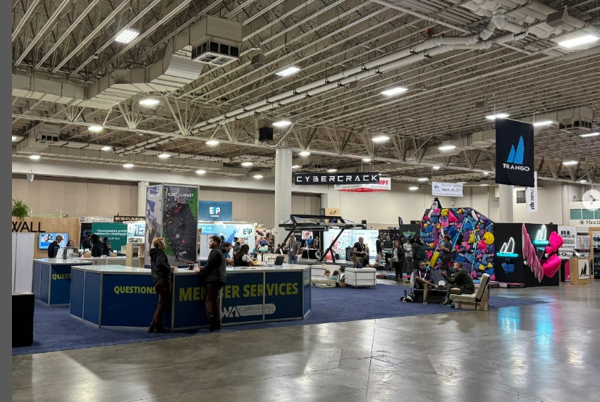 Crowds attending a large event at the Salt Palace Convention Center under energy-efficient LED lighting.